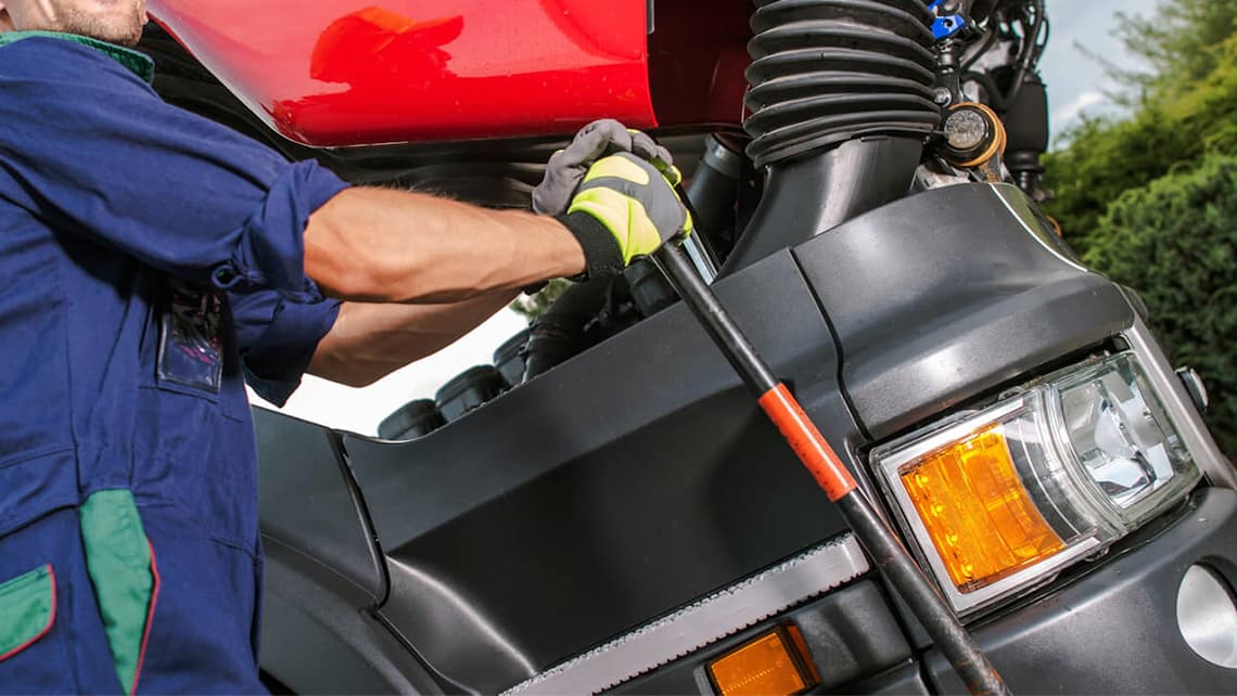 Technician working on a commercial vehicle